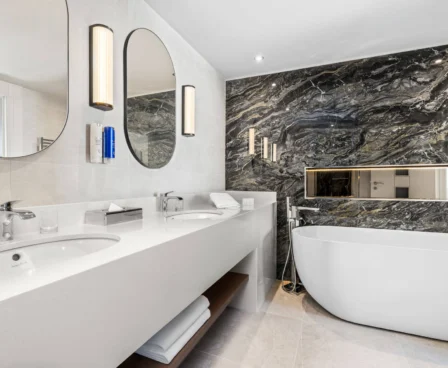 Luxurious marble bathroom with a freestanding tub at The Galmont Hotel.