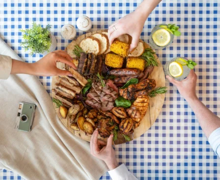 Family sharing a mixed grill platter on a chequered tablecloth at The Galmont Hotel.