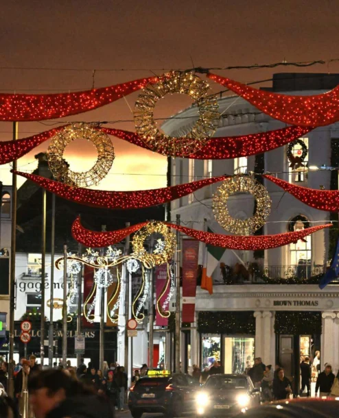 Festive street with families under Christmas lights in front of The Galmont Hotel & Spa.
