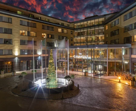 Family enjoying a festive evening outside The Galmont Hotel & Spa entrance.