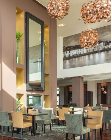 Elegant dining area in The Galmont Hotel with plush seating and modern décor.