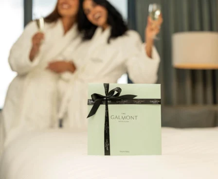 Two people in robes enjoying champagne at The Galmont Hotel & Spa.