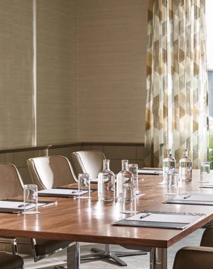Modern meeting room with natural light and elegant furnishings at The Galmont Hotel.