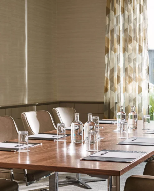 Modern meeting room with natural light and elegant furnishings at The Galmont Hotel.