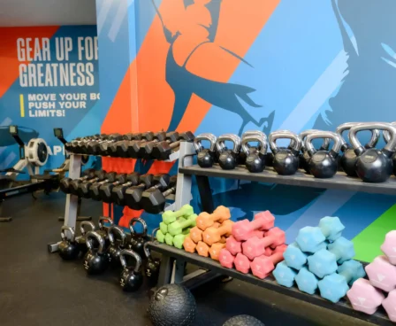 Modern gym with colourful weights and motivational wall art at The Galmont Hotel & Spa.