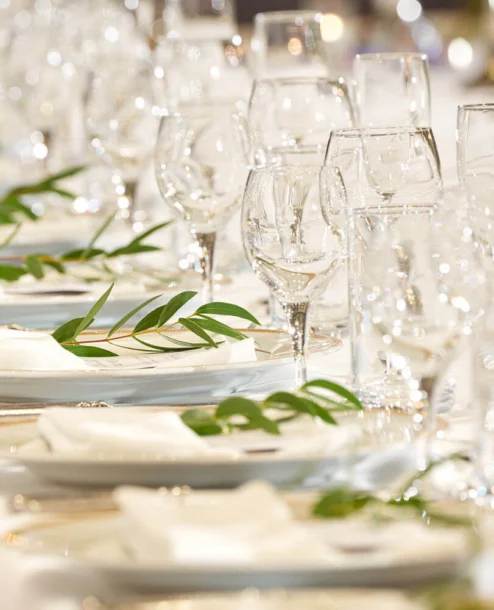 Elegant table setting with greenery and crystal glassware at The Galmont Hotel & Spa.