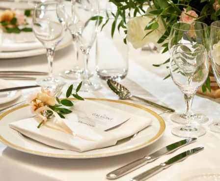 Elegant table setting at The Galmont Hotel with floral decor and sparkling glassware.
