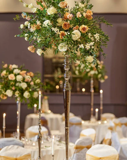 Elegant dining setup with tall floral centrepieces at The Galmont Hotel & Spa.