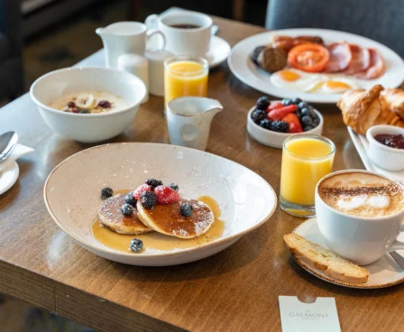 Family enjoying breakfast with pancakes and fresh fruit at The Galmont Hotel.