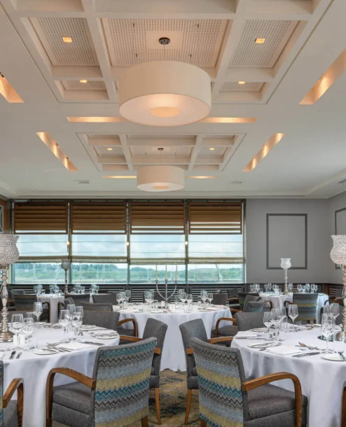 Elegant dining room with round tables set for a family gathering at The Galmont Hotel & Spa.
