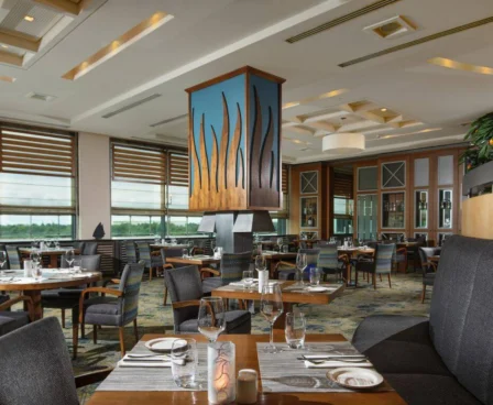 Elegant restaurant at The Galmont Hotel & Spa with stylish seating and large windows.