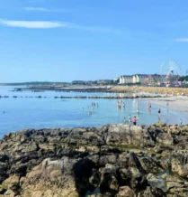 Families enjoying a sunny day at the beach near The Galmont Hotel & Spa in Ireland.