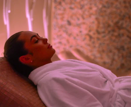 Woman relaxing on a spa lounger at The Galmont, enjoying a peaceful ambience.