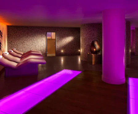 Family relaxing in serene, warmly lit spa at The Galmont Hotel & Spa.
