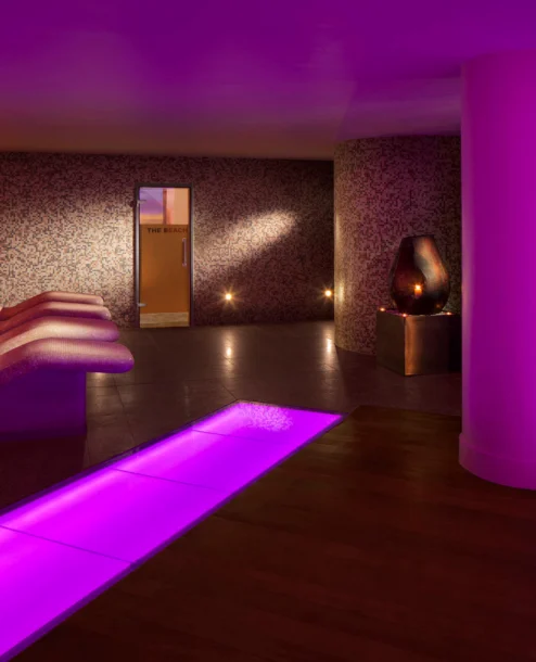 Family relaxing in serene, warmly lit spa at The Galmont Hotel & Spa.