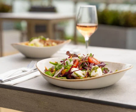 Outdoor dining with fresh salads and rosé at The Galmont Hotel & Spa.