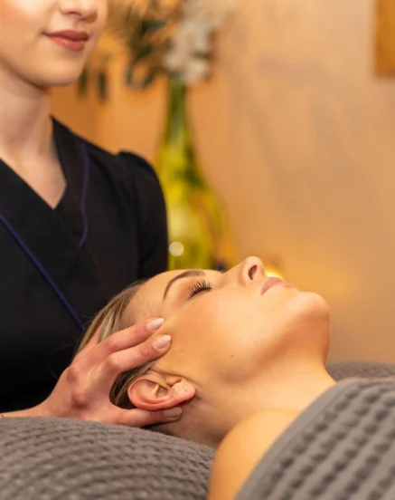 Spa therapist giving a relaxing facial massage at The Galmont Hotel & Spa.
