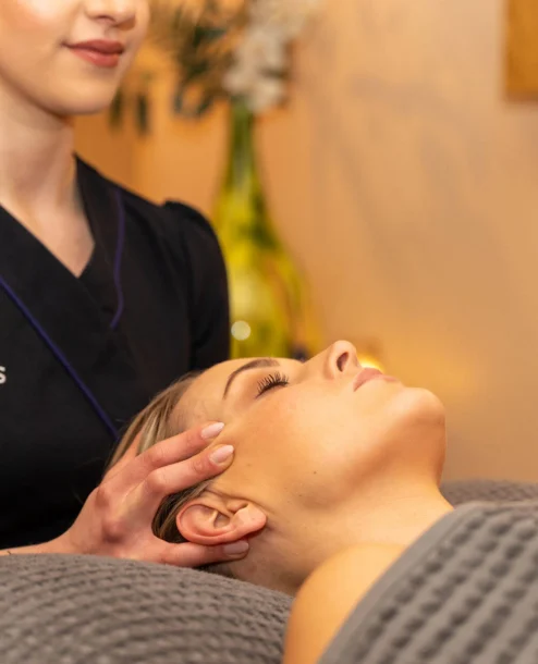Spa therapist giving a relaxing facial massage at The Galmont Hotel & Spa.