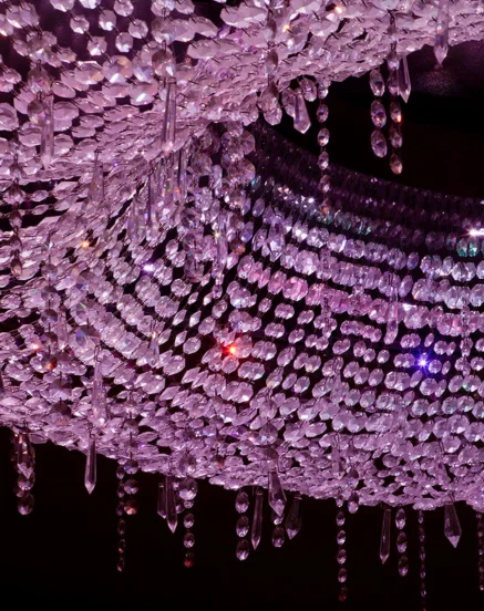 Elegant crystal chandelier with purple lighting at The Galmont Hotel & Spa.