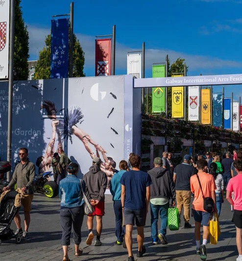 A lively group enjoys the Galway International Arts Festival near The Galmont Hotel.