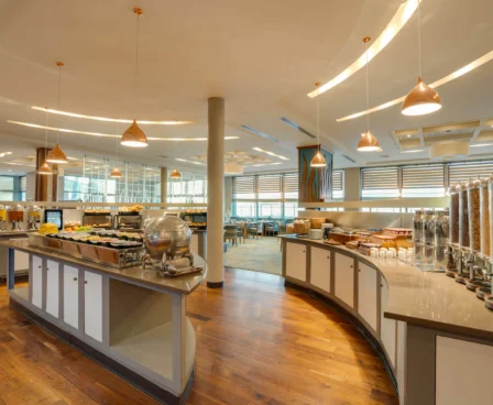 Bright, inviting breakfast buffet area at The Galmont Hotel, with cereals and fresh pastries.