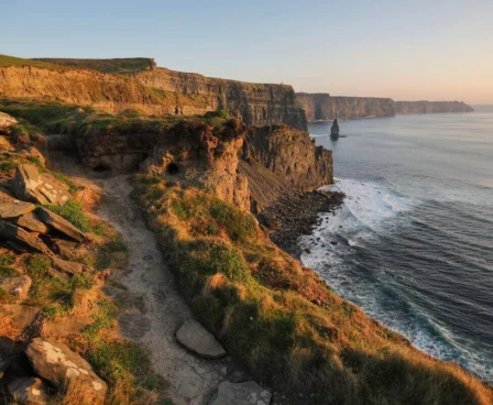 Family walking along scenic cliffside path at sunset near The Galmont Hotel & Spa.