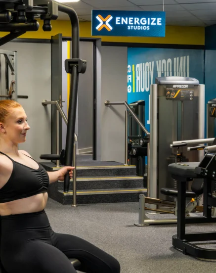 Woman exercising on gym equipment at The Galmont Hotel & Spa fitness centre.