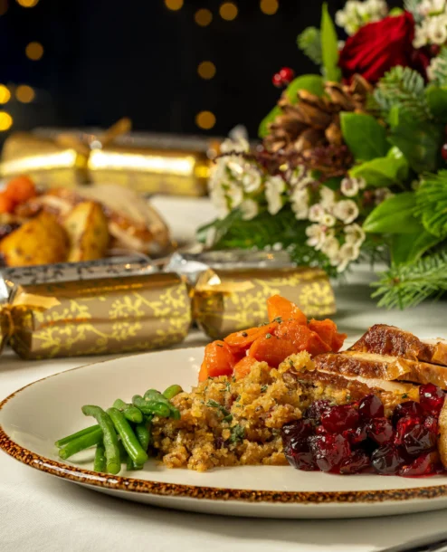 Festive dinner at The Galmont Hotel with Christmas decorations and vibrant table setting.
