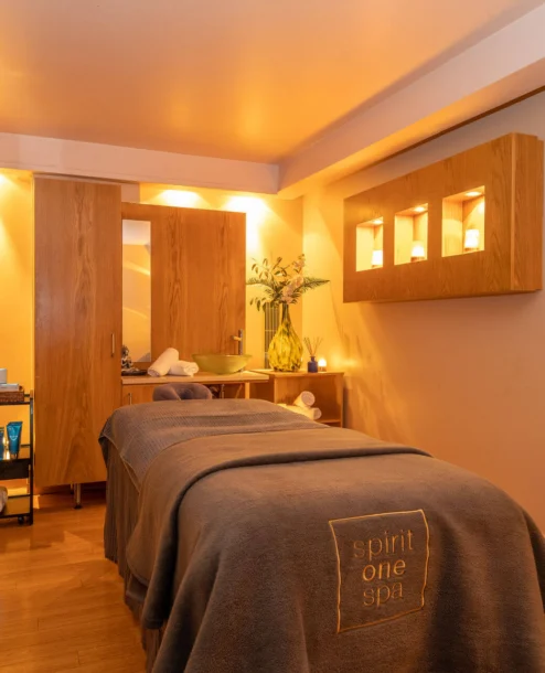 Cosy spa treatment room with a massage bed at The Galmont Hotel & Spa.
